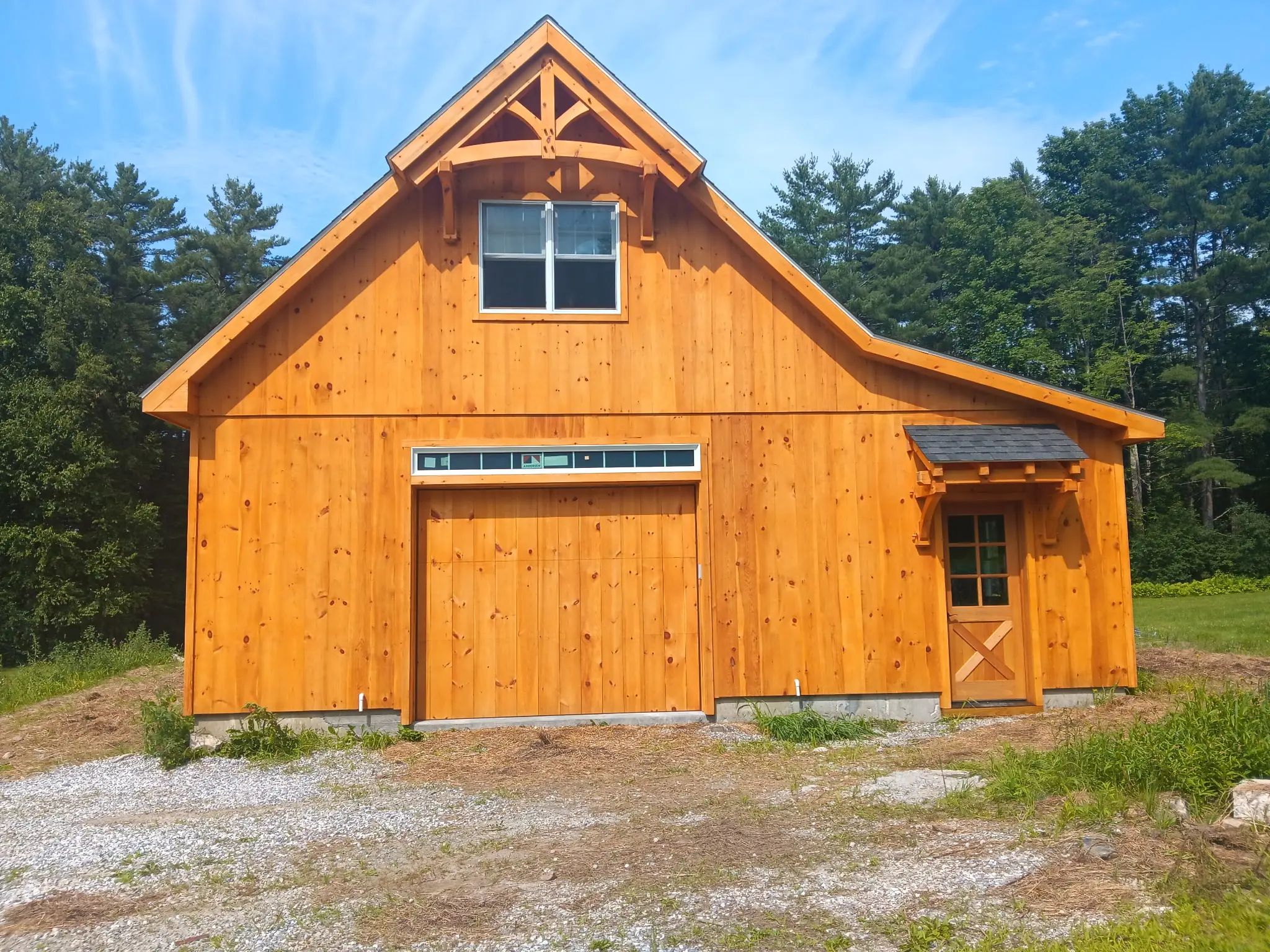 Barn garage front showing natural stain color