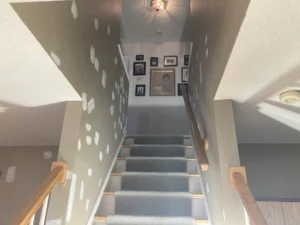 Interior stairwell prepared for painting.