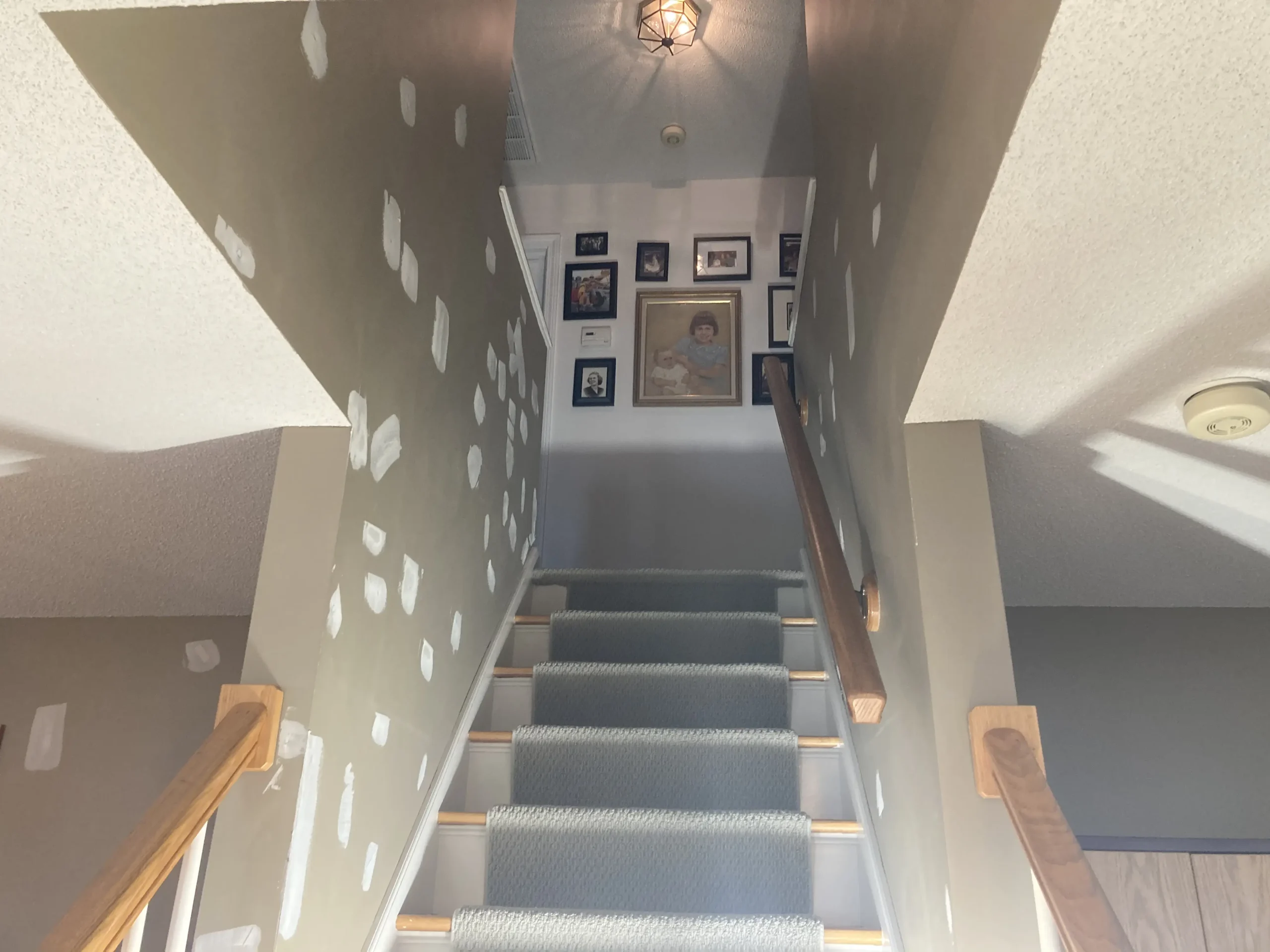 Interior stairwell prepared for painting.